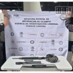 Aseguran rifle y casi un kilo de marihuana en autobús de pasajeros en Ecuandureo
